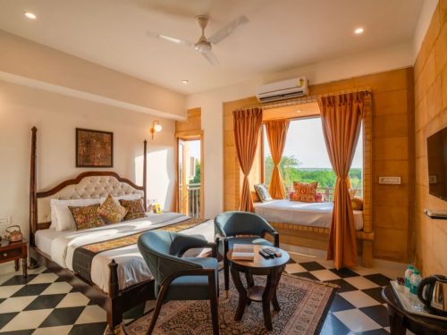 Hotel Helsinki House deluxe room with king-size bed and Jharokha-style windows