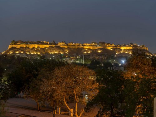 Jaisalmer fort view at night from rooftop restaurant Helsinki House